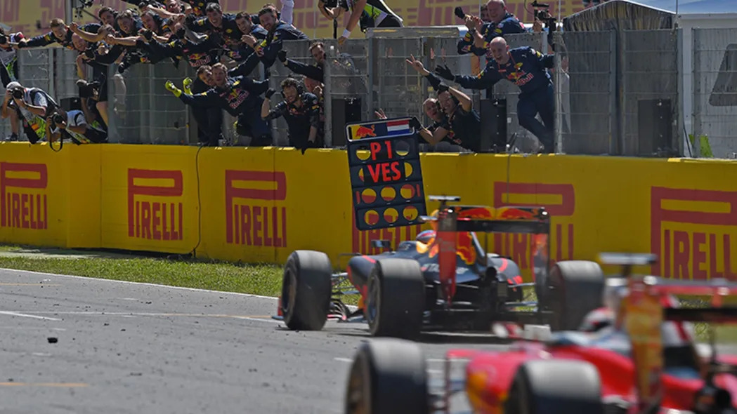 Red Bull's Belgian-Dutch driver Max Verstappen (C) wins ahead of Ferrari's Finnish driver Kimi Raikkonen at the Circuit de Catalunya on May 15, 2016 in Montmelo on the outskirts of Barcelona during the Spanish Formula One Grand Prix.