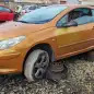 99 - 2006 Peugeot 307CC in British wrecking yard - photo by Murilee Martin