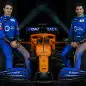 IMAGE DISTRIBUTED FOR MCLAREN - McLaren drivers Lando Norris, left, and Carlos Sainz, sit either side of McLaren's new 2020 Formula 1 car, the MCL35, unveiled at the McLaren Technology Centre on Thursday, Feb. 13, 2020, in Woking, United Kingdom. Press release and full launch media assets available to download at http://www.apmultimedianewsroom.com/multimedia-newsroom/mclaren-reveals-the-mcl35-to-the-world. (Zak Mauger/McLaren via AP Images)