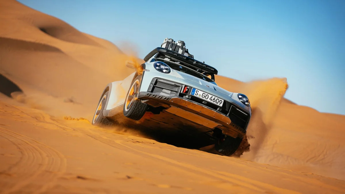 2023 Porsche 911 Dakar in Shade Green airbourne on dune