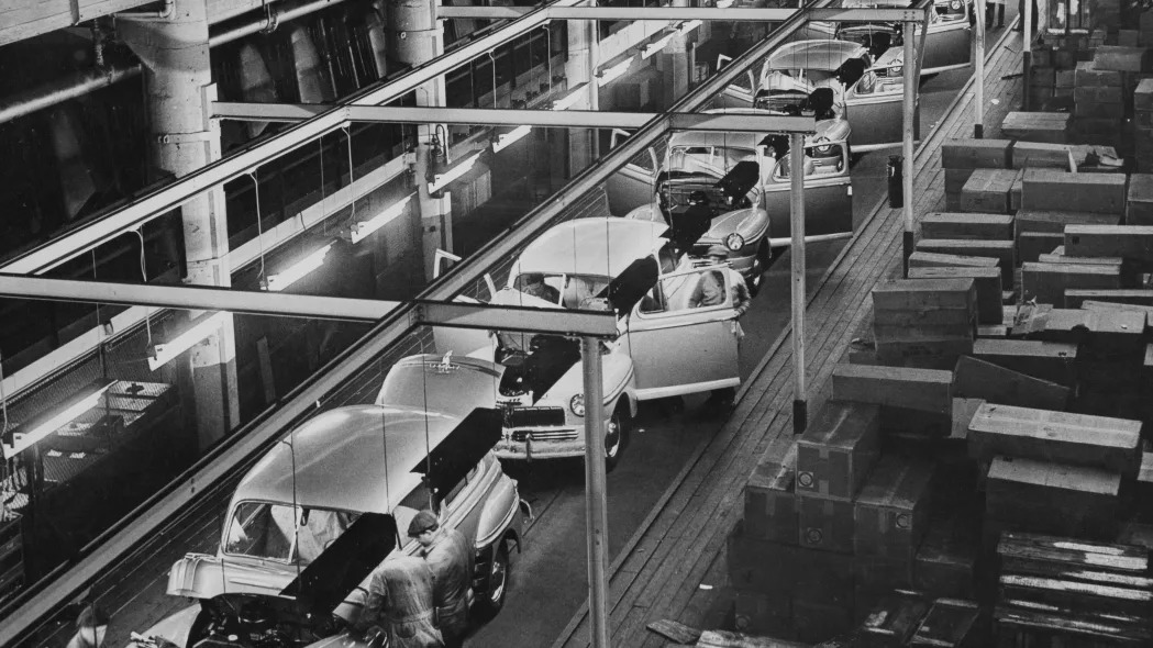 Automobile workers putting the finishing touches to 1947 models of the Mercury, one of three automobiles manufactured by the Ford Motor Company, at the company's River Rouge Complex in Dearborn, Michigan, 1947.