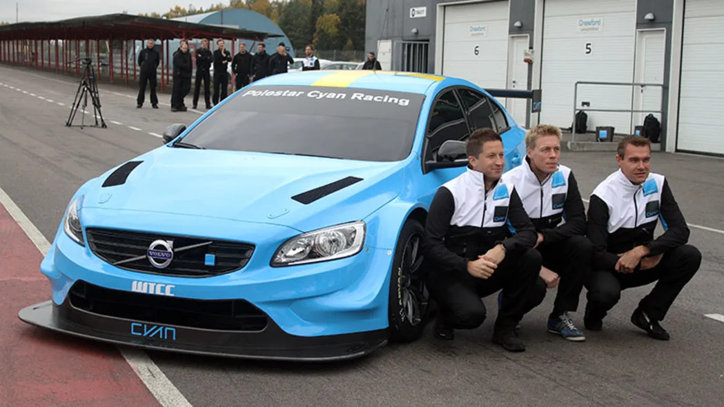 The Volvo S60 Polestar TC1 WTCC race car poses with the three development drivers for Cyan Racing.