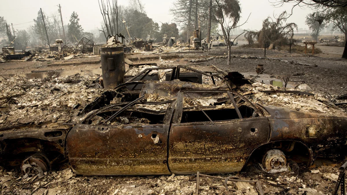 A neighborhood destroyed by fire is seen as wildfires devastate the region, Friday, Sept. 11, 2020 in Talent, Ore. (AP Photo/Paula Bronstein)