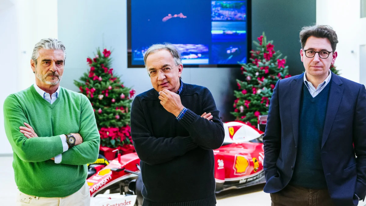 Sergio Marchionne with Ferrari executives and an F1 car