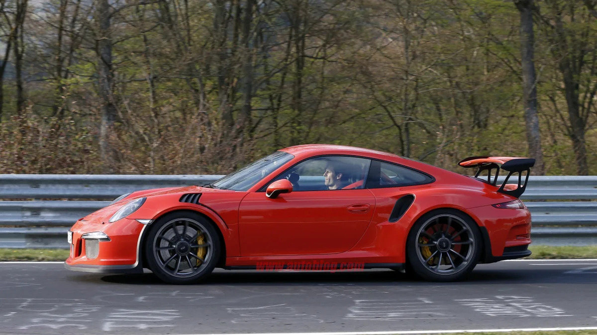 Mark Webber does promotional work in the new Porsche 911 GT3 RS at the Nuerburgring, side view.