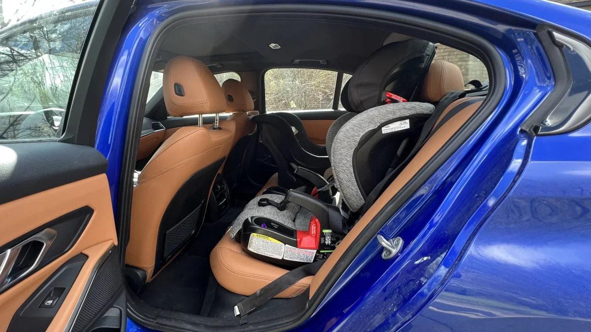 2022 BMW 330e with front-facing seat behind driver