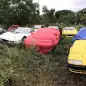 Abandoned Ferraris in field
