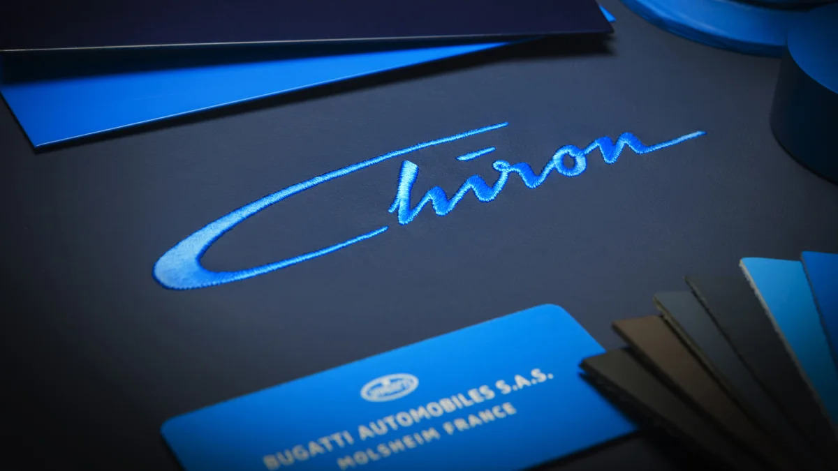 Bugatti Chiron script nameplate stitching teaser detail