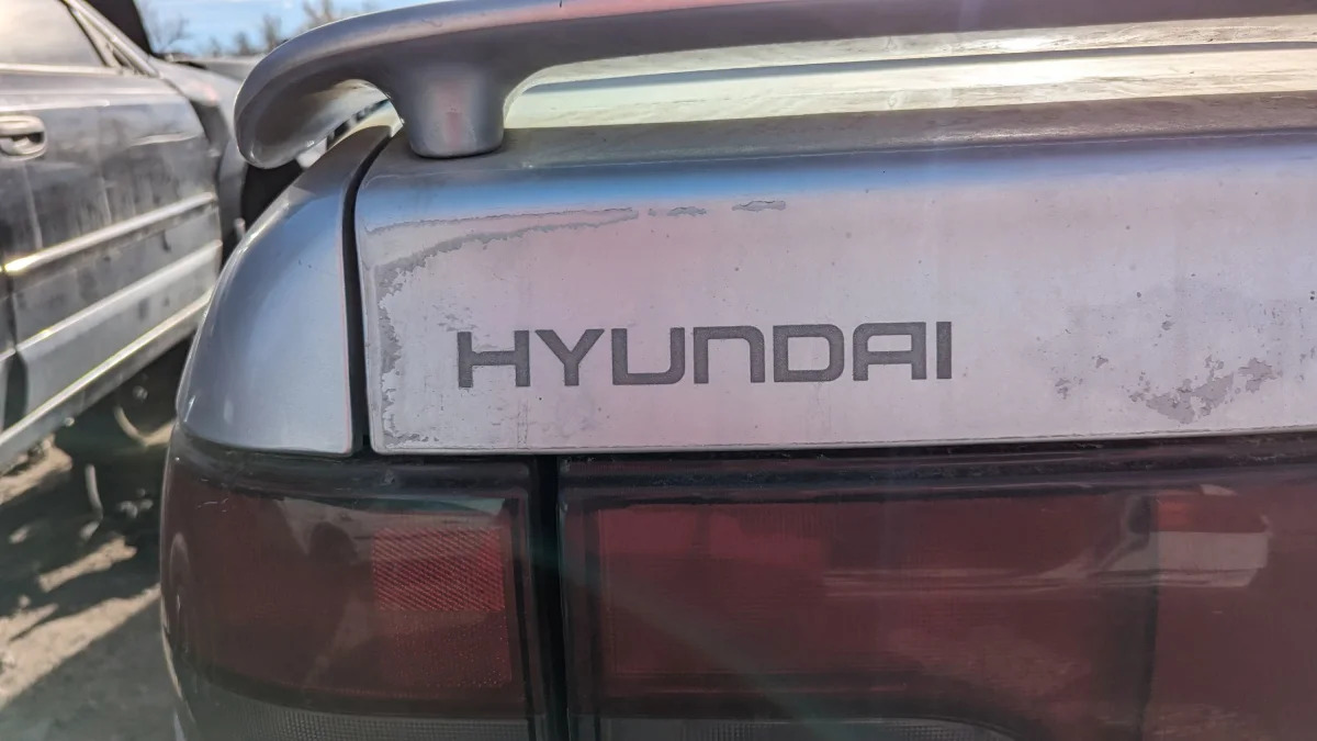 03 - 1993 Hyundai Scoupe in Colorado junkyard - photo by Murilee Martin