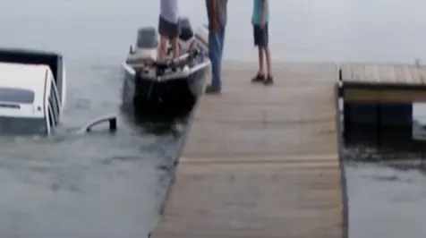 <h6><u>Watch this GMC Sierra pickup slide down a boat launch into a lake</u></h6>