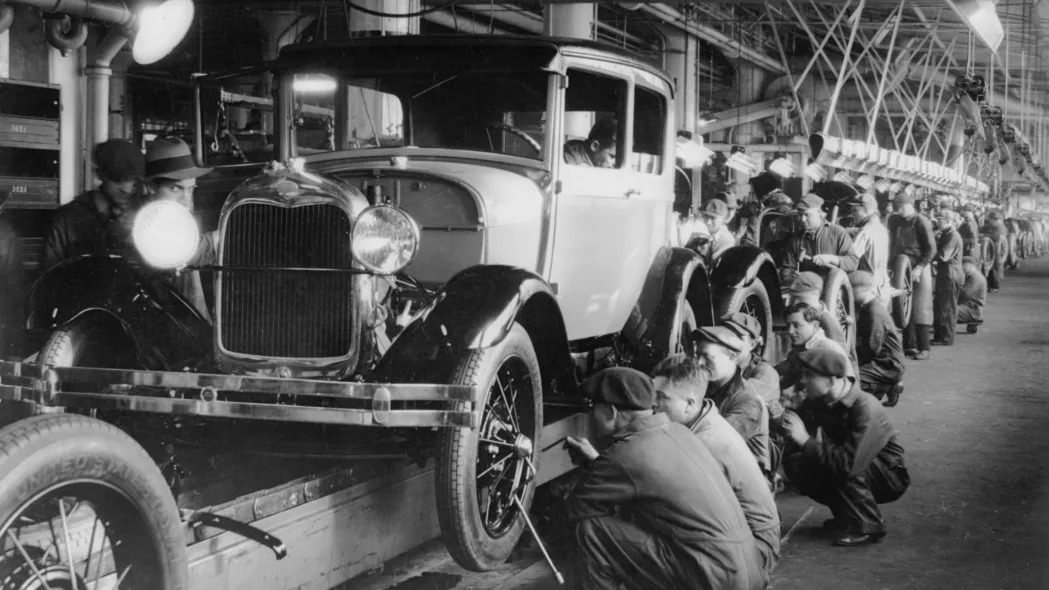 1927: The production line at a Ford motor factory in Michigan, USA.