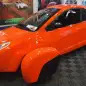 Elio Motors orange trike front three-quarter