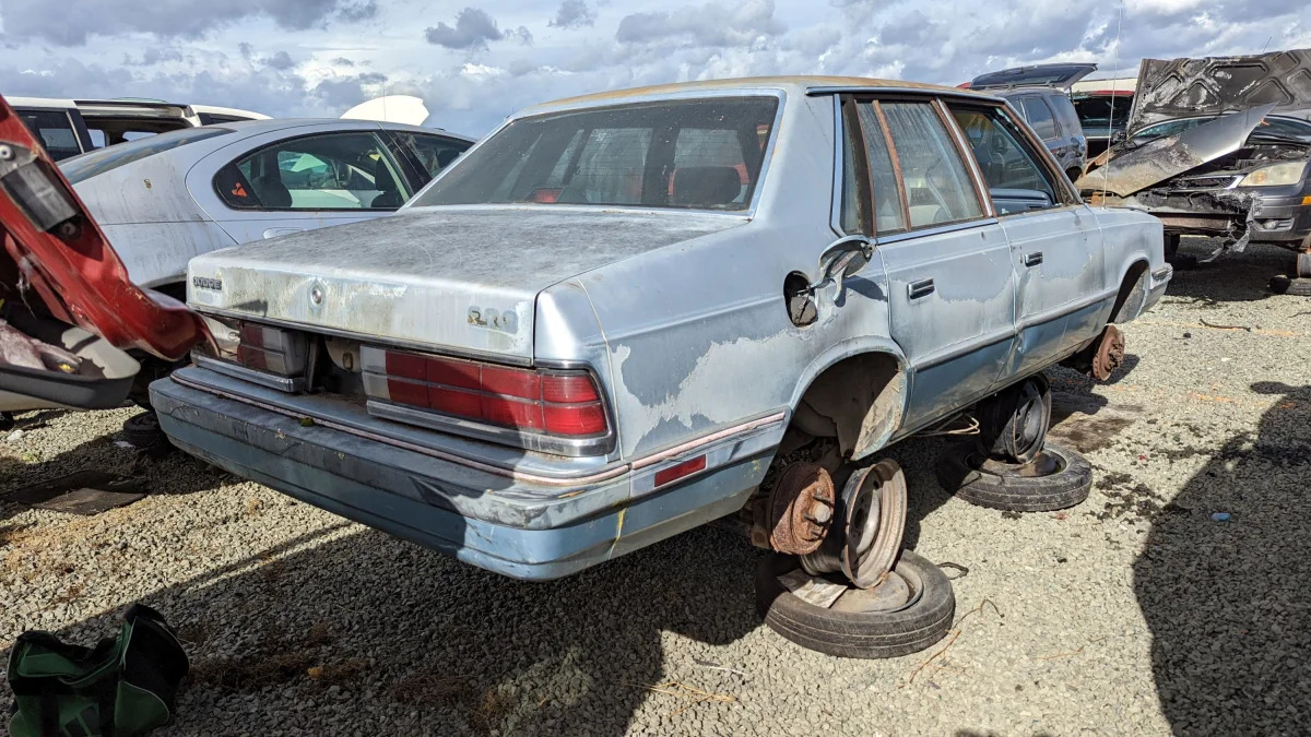 35 - 1987 Dodge 600 Sedan in California junkyard - photo by Murilee Martin