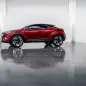 The Scion C-HR concept shown off in red for the LA Auto Show, side view indoor.