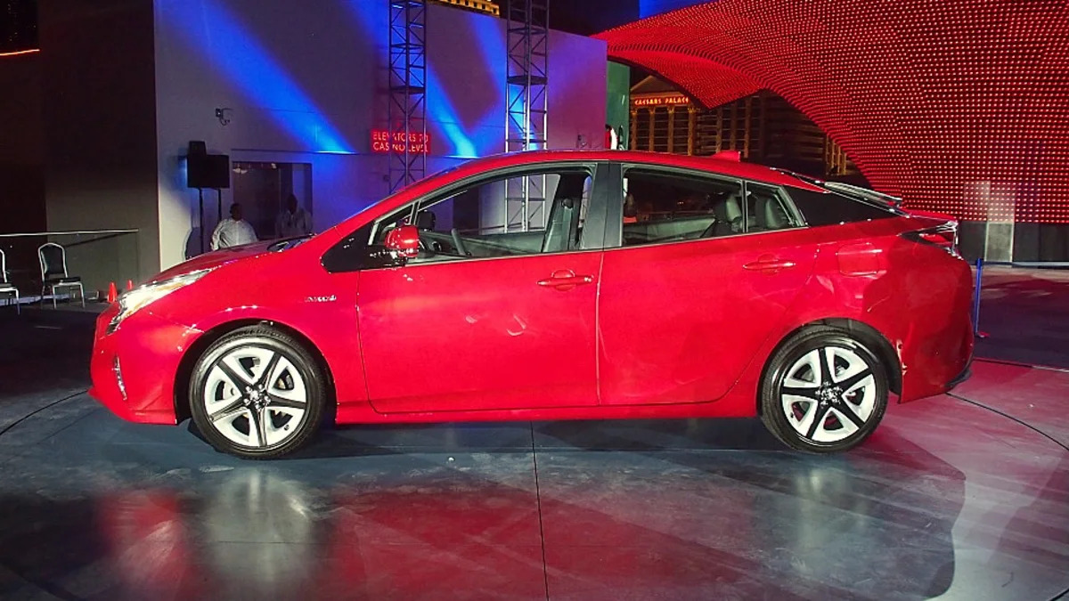 2016 Toyota Prius red, at reveal event, side profile