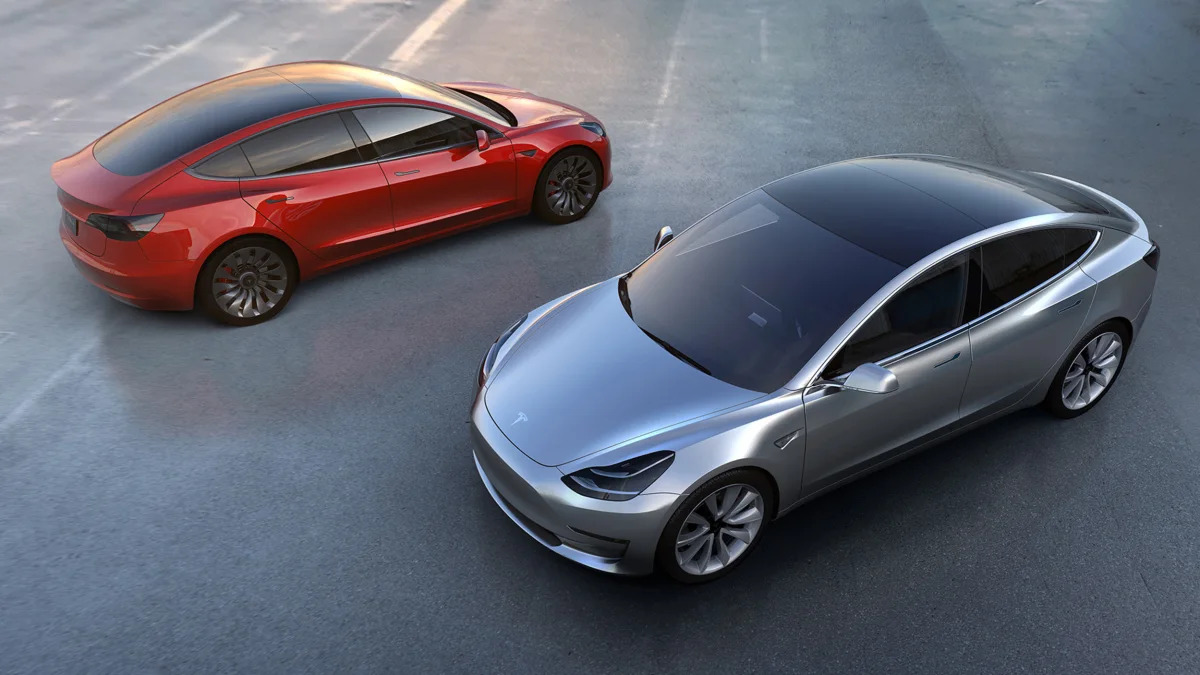tesla model 3 red and silver above