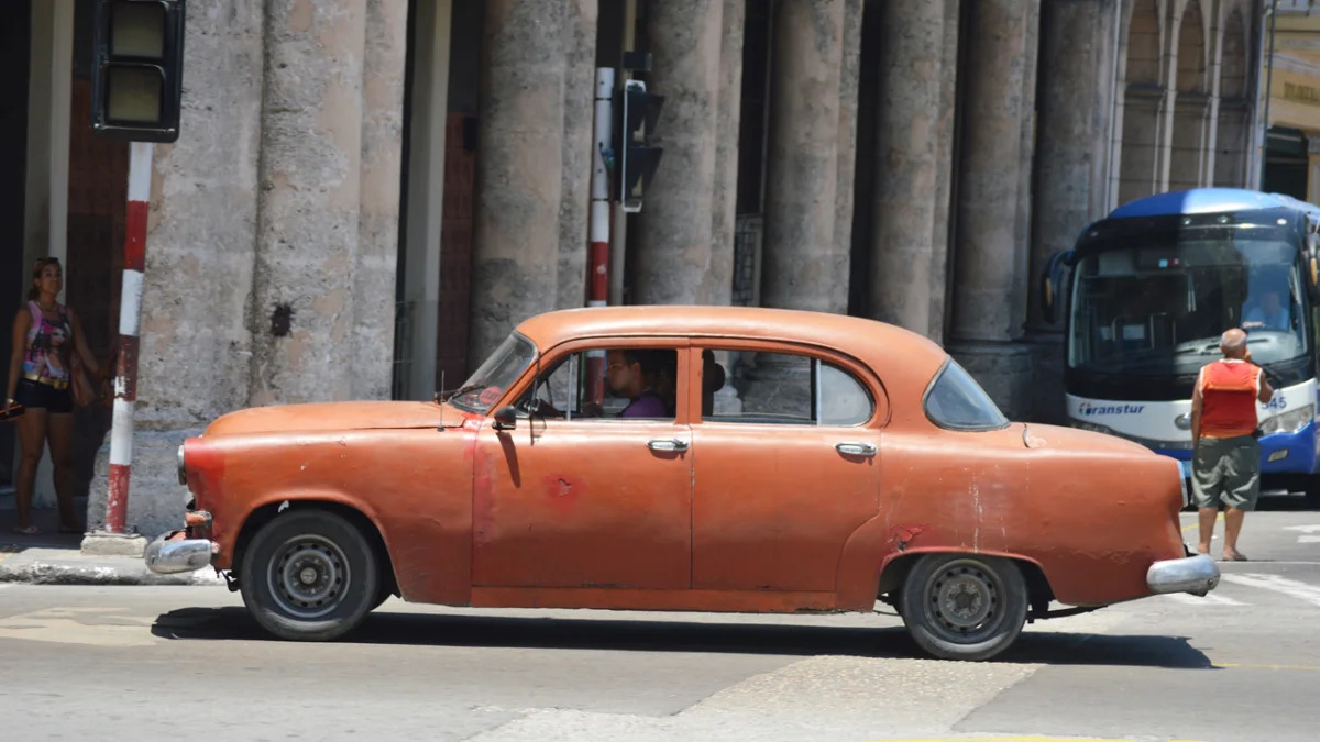 classic orange sedan, havana, cuba 