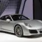 The 2016 Porsche 911 Carrera, now with a turbocharged engine in the standard car, unveiled at the Frankfurt Motor Show, front three-quarter view.