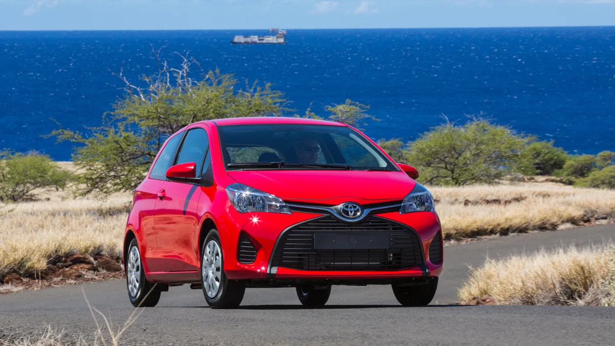 2014 Toyota Yaris in red at the ocean
