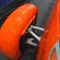 Elio Motors orange trike front wheel cover
