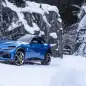 Ferrari Purosangue front three quarter blue in the snow