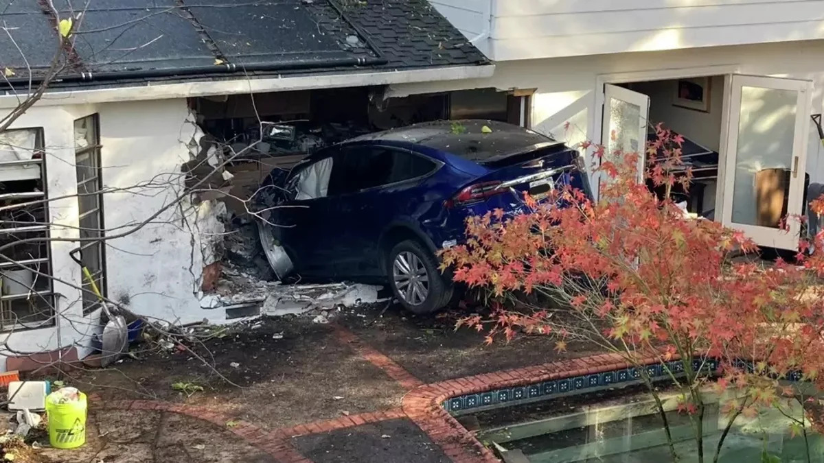 Tesla Model X crashes into a house