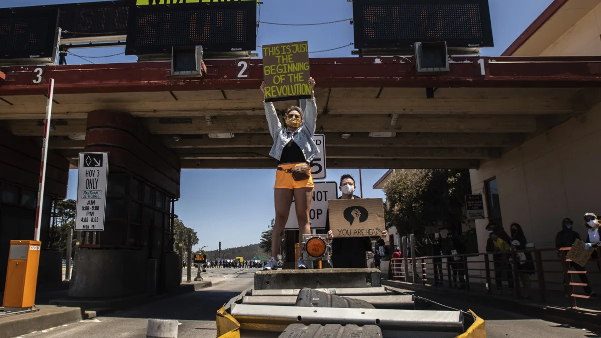 SAN FRANCISCO, CA- JUNE 6: Protestors stand at the entrance to the toll plaza near the Golden Gate Bridge in San Francisco, California on June 6, 2020 after the death of George Floyd. Credit: Chris Tuite/ImageSPACE/MediaPunch /IPX