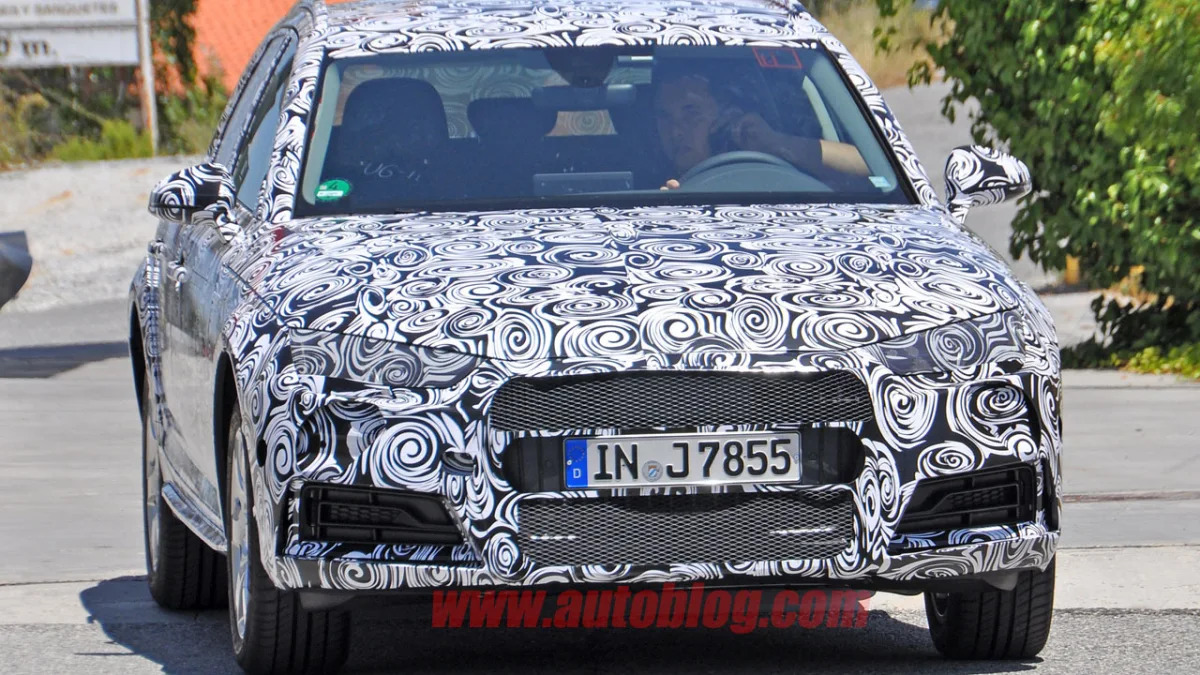 camouflaged audi a4 allroad spy shots front