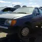17 - 1985 Ford Tempo in Colorado junkyard - photo by Murilee Martin