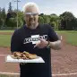 Guy Fieri with apple pie hot dogs