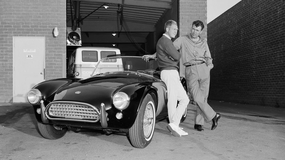 Steve McQueen and Carroll Shelby with a Cobra roadster