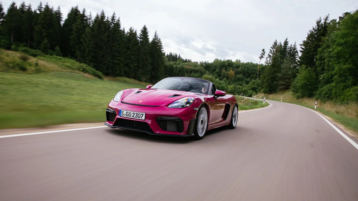 2024 Porsche 718 Spyder RS in Ruby Star Neo action front three quarter low