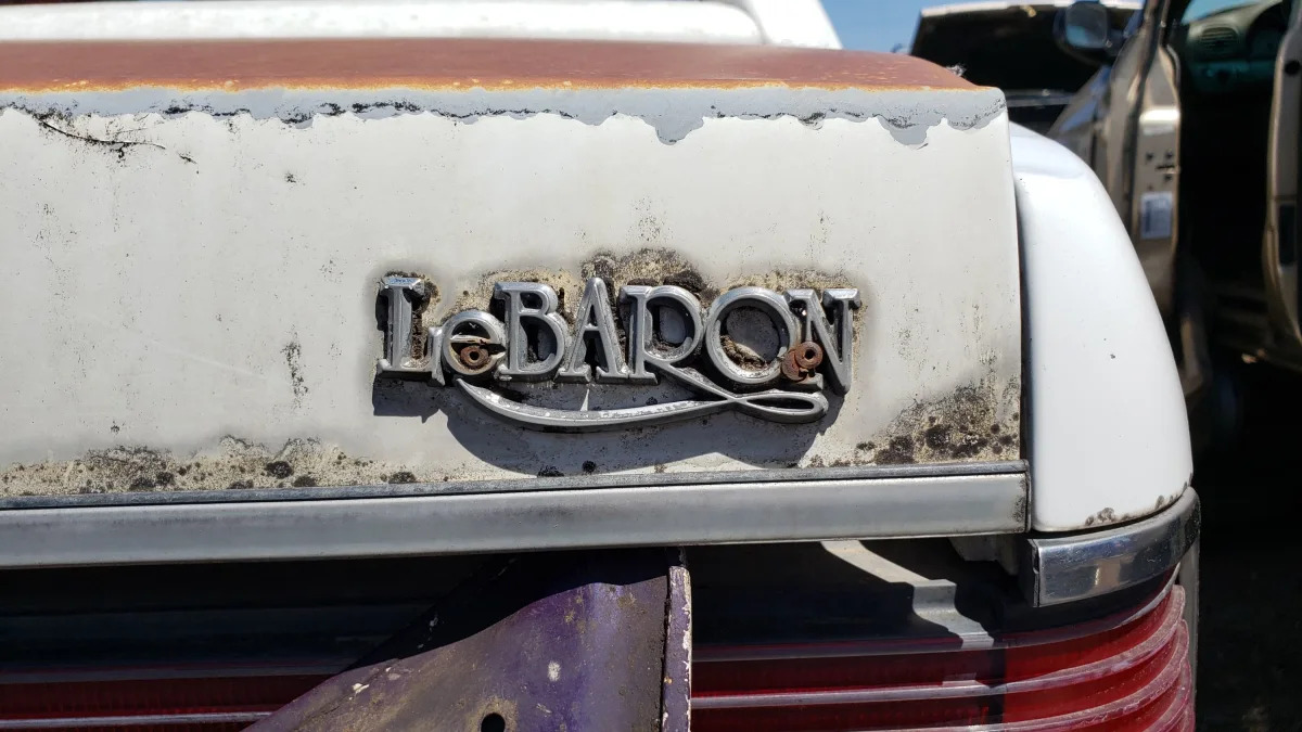 40 - 1988 Chrysler LeBaron in Colorado junkyard - photo by Murilee Martin