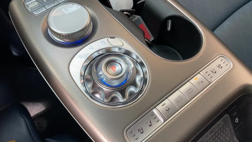 The Genesis GV60 electric SUV interior with its rotating gear shifter.