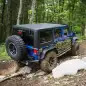 Project Trail Force 2015 Jeep Wrangler Rubicon climbing a trail.