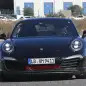 Spy shot of the next-generation 992-model Porsche 911 thought to hide a hybrid powertrain, front.