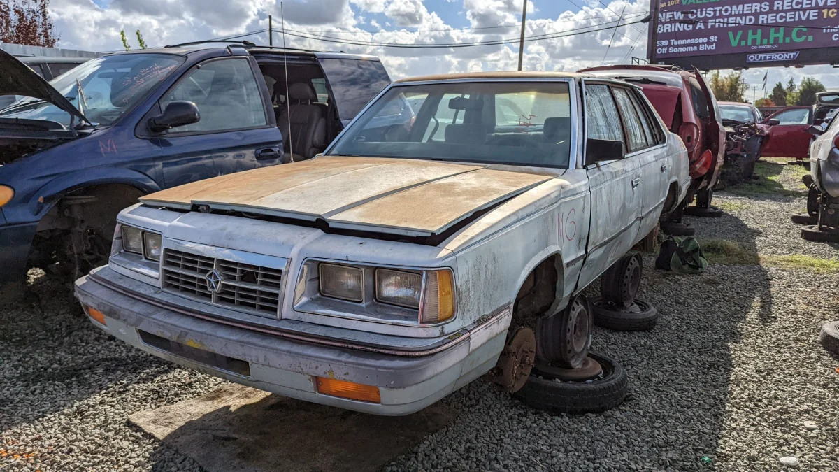 27 - 1987 Dodge 600 Sedan in California junkyard - photo by Murilee Martin