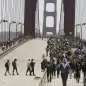 People cross over lanes to join others marching south on the Golden Gate Bridge in San Francisco, Saturday, June 6, 2020, at a protest over the Memorial Day death of George Floyd. Floyd died May 25 after being restrained by Minneapolis police. (AP Photo/Jeff Chiu)