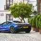 McLaren Artura blue parked like a jerk
