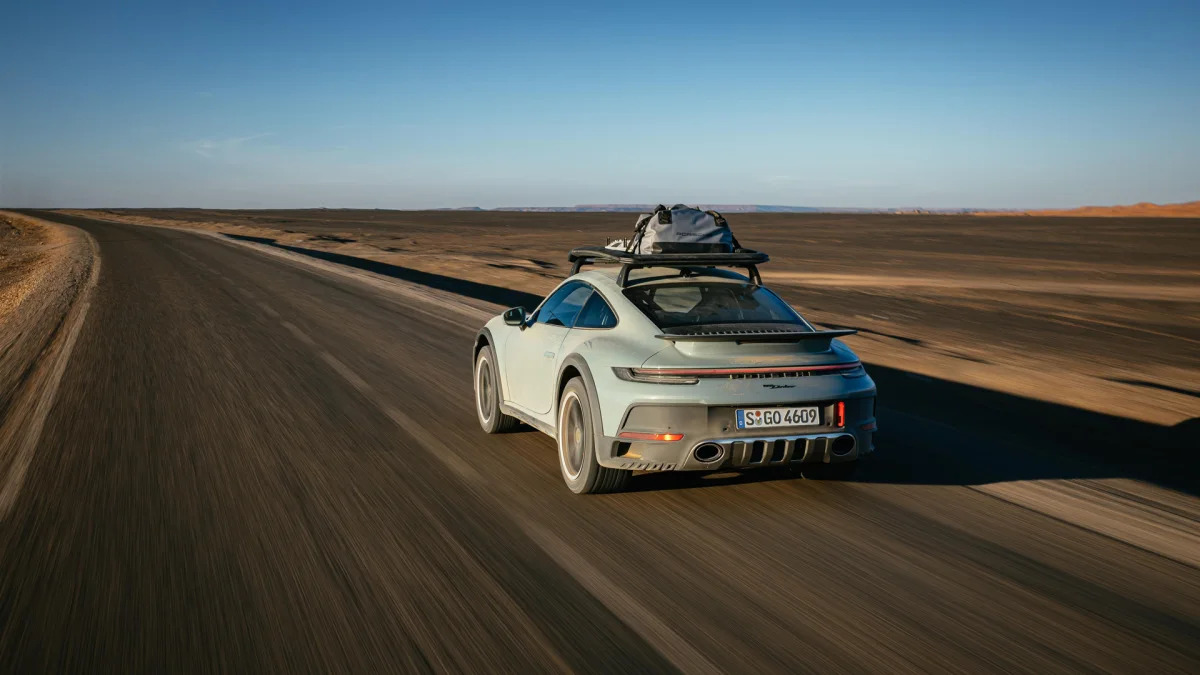 2023 Porsche 911 Dakar in Shade Green action rear road