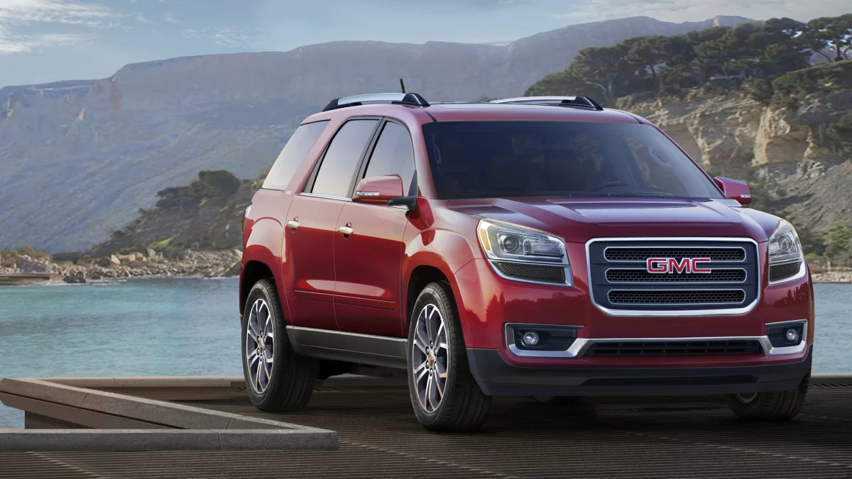 2015 GMC Acadia in red by the ocean