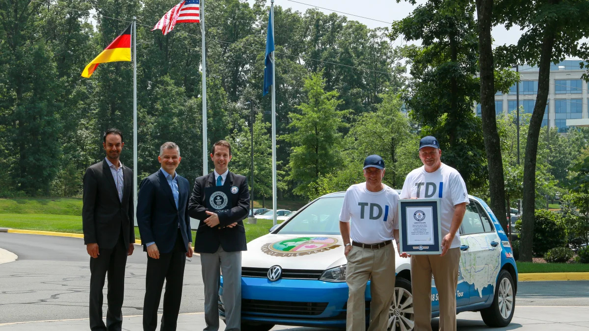 VW executives with record-setting team and 2015 VW Golf TDI