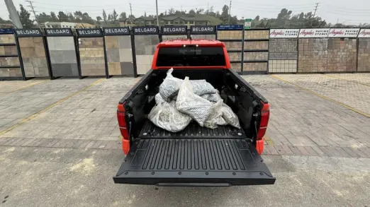 Tacoma bed loaded with rock