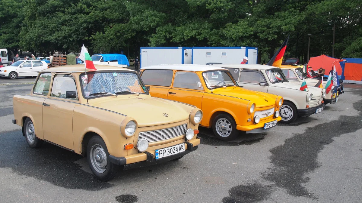 Trabis lined up with flags at the 2015 Trabant Fest in Zwickau, Germany.