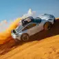 2023 Porsche 911 Dakar in Shade Green sideways on dune from above