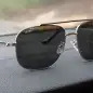 BMW sunglasses on dash