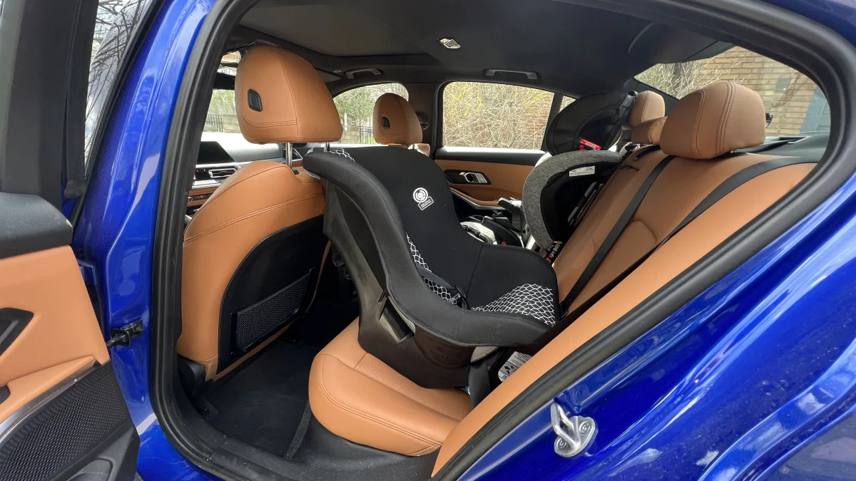 2022 BMW 330e with rear-facing seat behind driver