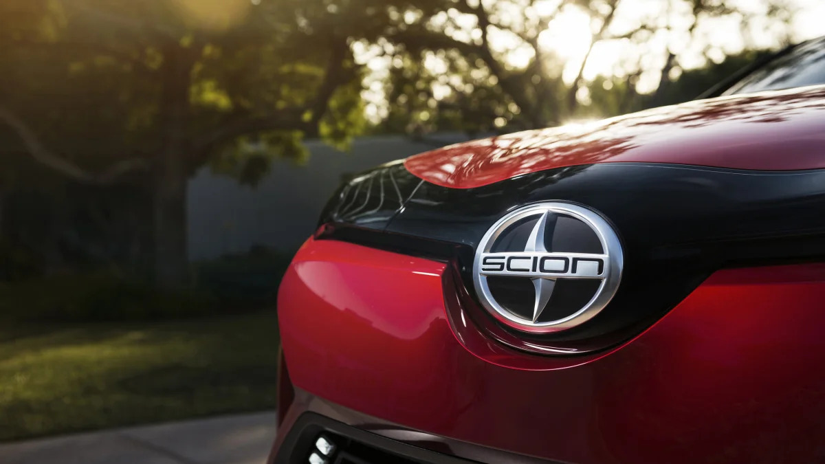 The Scion C-HR concept shown off in red for the LA Auto Show, detail of the hood badge.