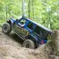 Project Trail Force 2015 Jeep Wrangler Rubicon getting up a hill.
