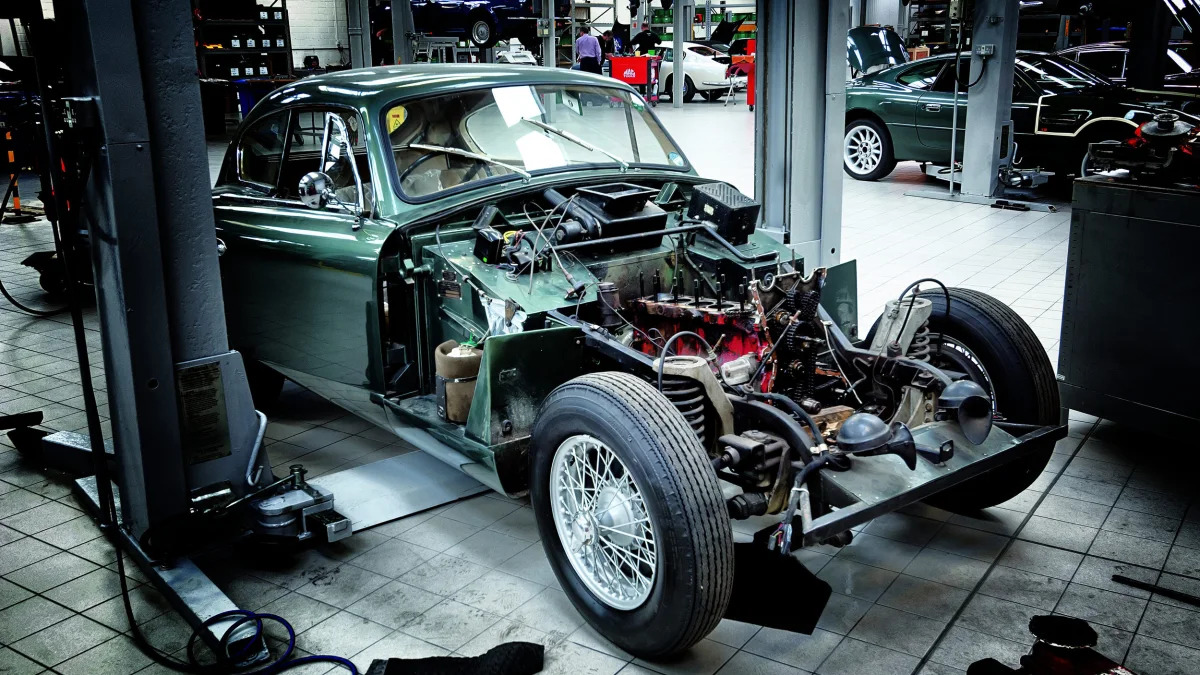 An Aston Martin is taken apart for mechanical inspection at Aston Martin Works at Newport Pagnell.